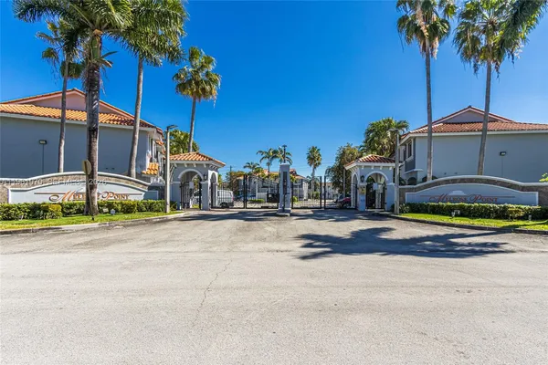 a couple of cars parked in front of a building