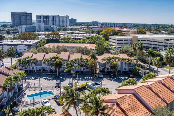 an aerial view of residential houses with outdoor space
