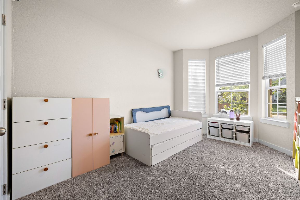 120 Upland Drive Georgetown, TX 78628 - Photo 13 of 21 Bedroom featuring carpet and baseboards