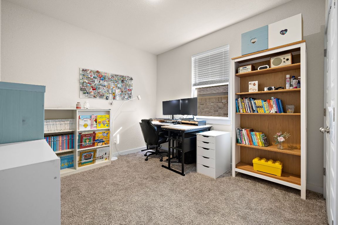 120 Upland Drive Georgetown, TX 78628 - Photo 17 of 21 Office area with light colored carpet and baseboards