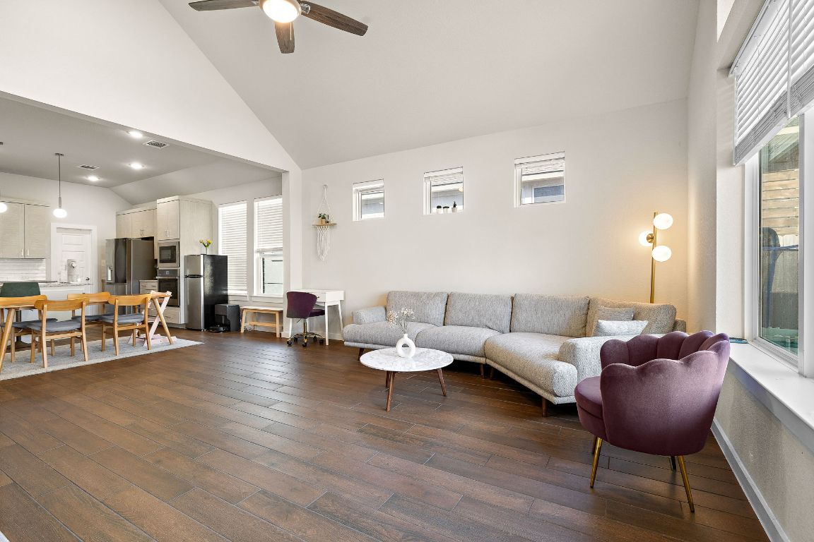 120 Upland Drive Georgetown, TX 78628 - Photo 3 of 21 Living area with high vaulted ceiling, dark wood-style flooring, and ceiling fan