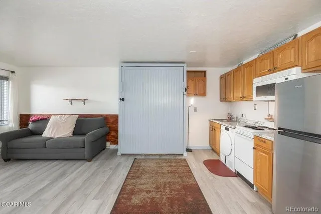 a living room with granite countertop furniture and a rug