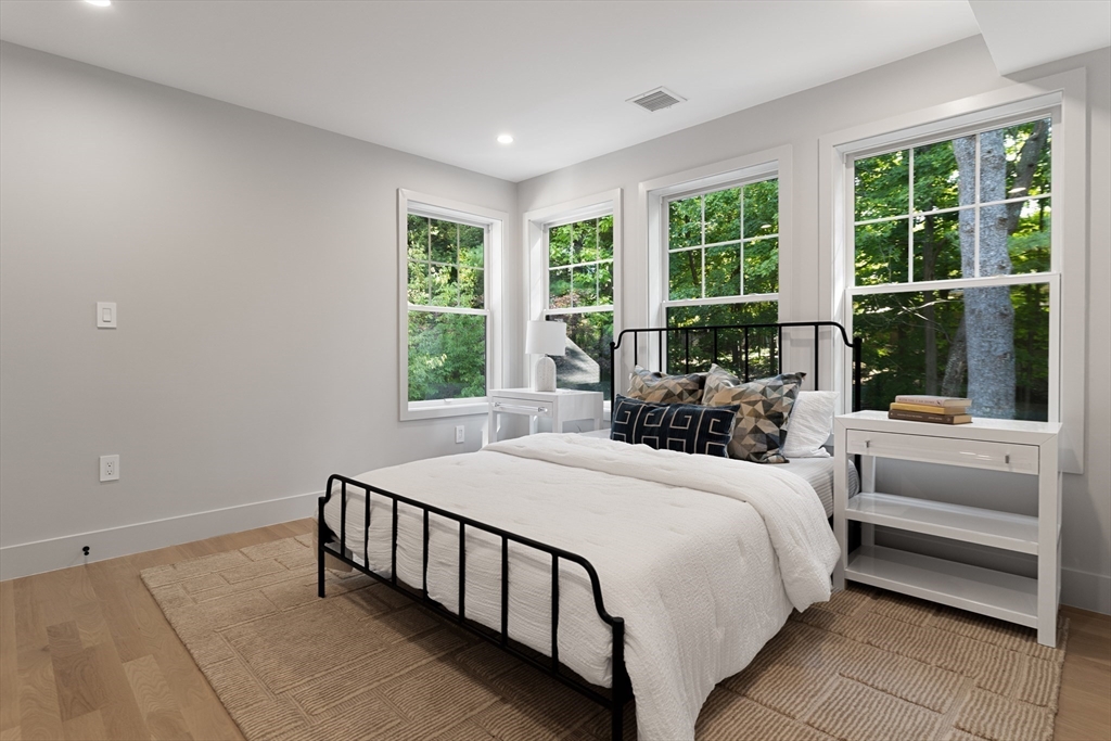 100 Varick Road Newton, MA 02468 - Photo 15 of 20 a bedroom with a bed and a couch