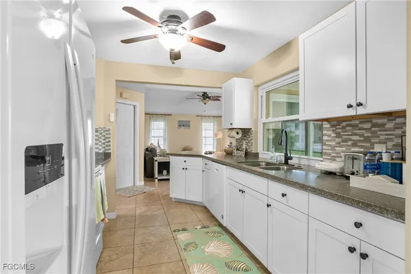 a kitchen with a sink and cabinets