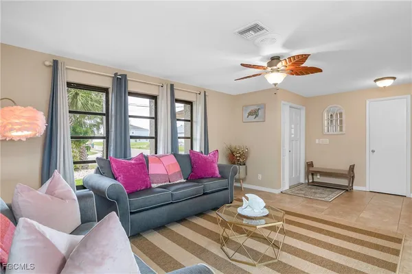 a living room with furniture and a window