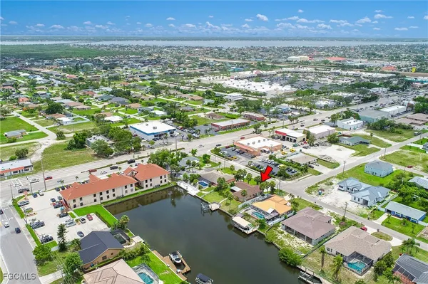 an aerial view of residential houses with outdoor space and street view