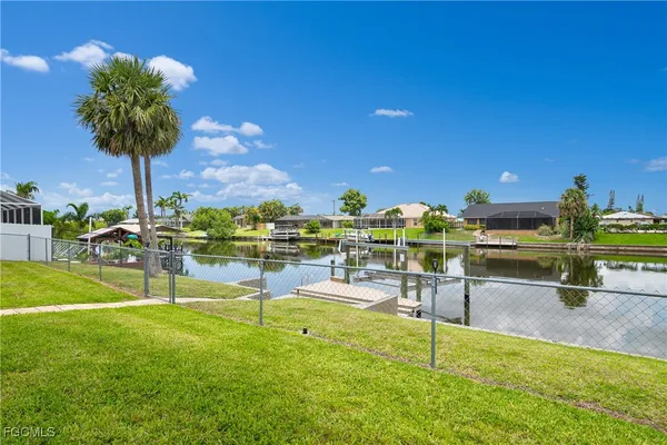 a view of a swimming pool with a table and chairs