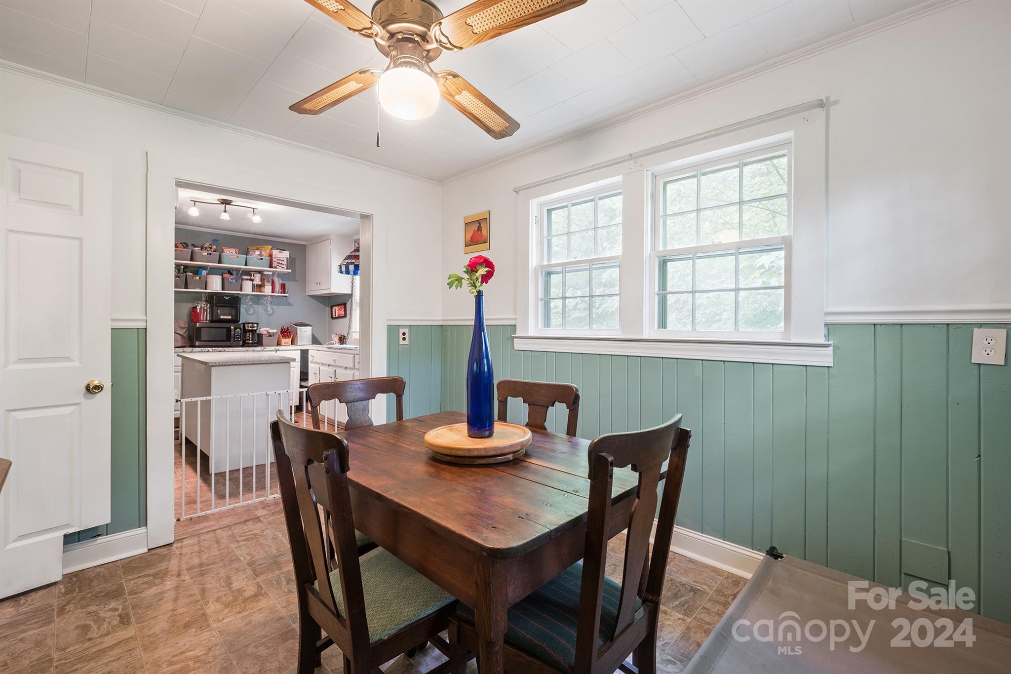 2711 Ellerwood Road Hudson, NC 28638 - Photo 12 of 19 a dining room with furniture a rug and a chandelier