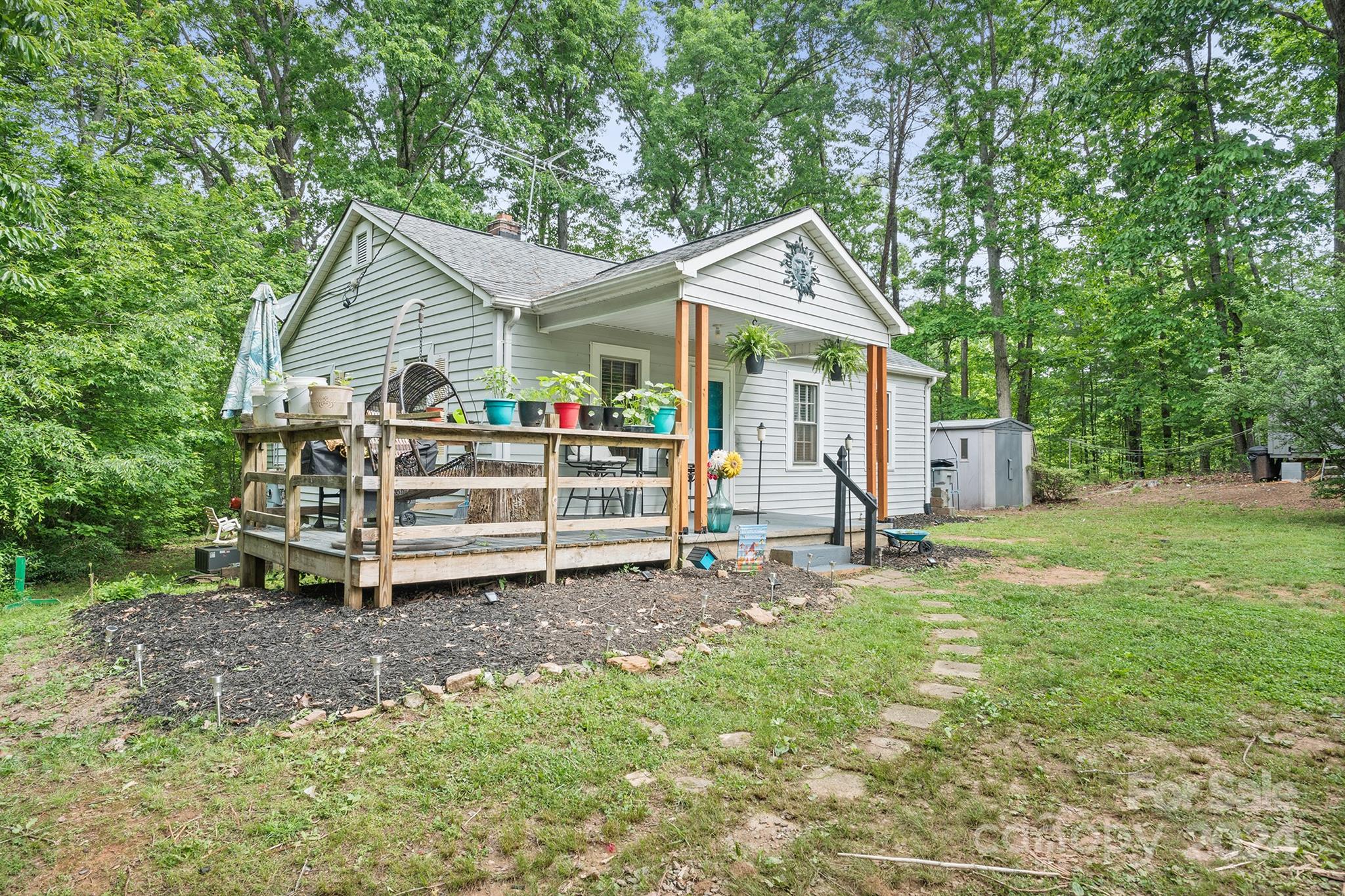 2711 Ellerwood Road Hudson, NC 28638 - Photo 3 of 19 a view of a house with backyard and a tree
