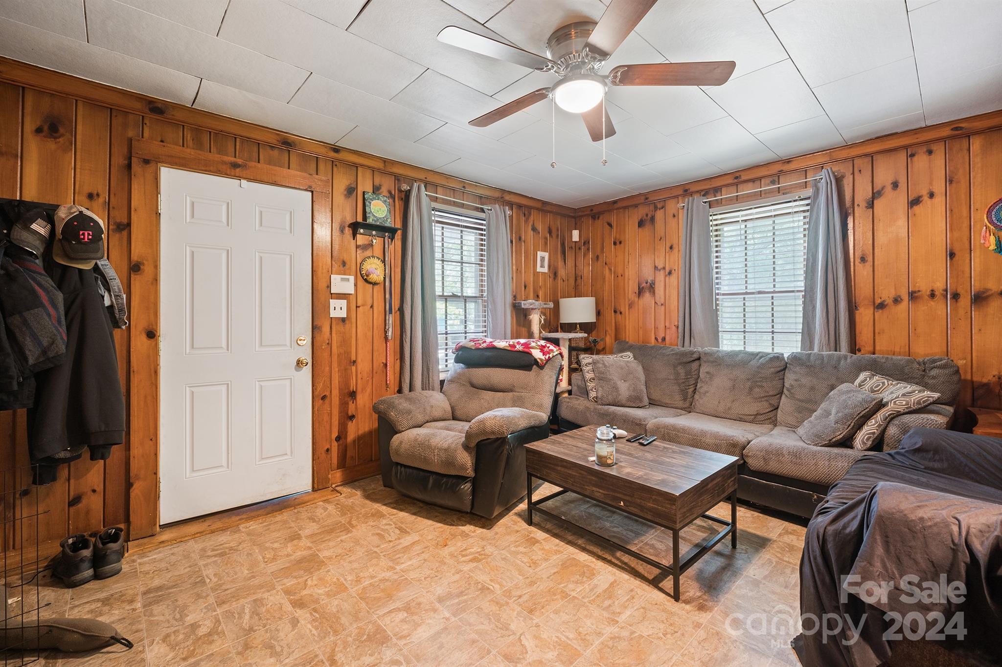 2711 Ellerwood Road Hudson, NC 28638 - Photo 6 of 19 a living room with furniture a ceiling fan and a window