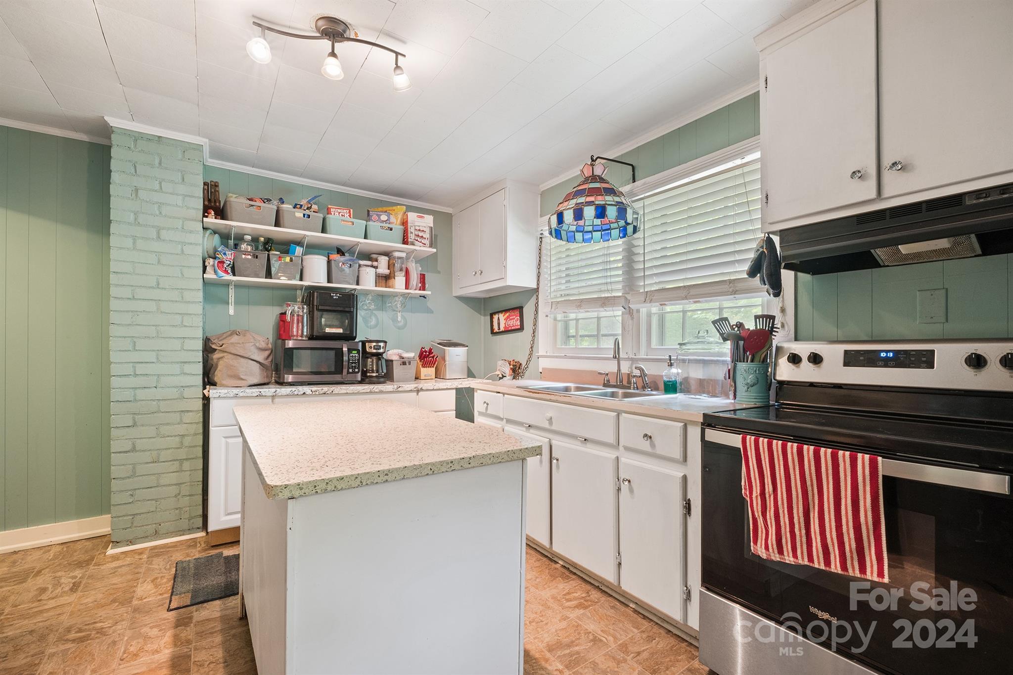 2711 Ellerwood Road Hudson, NC 28638 - Photo 7 of 19 a kitchen with stainless steel appliances granite countertop a stove and a sink
