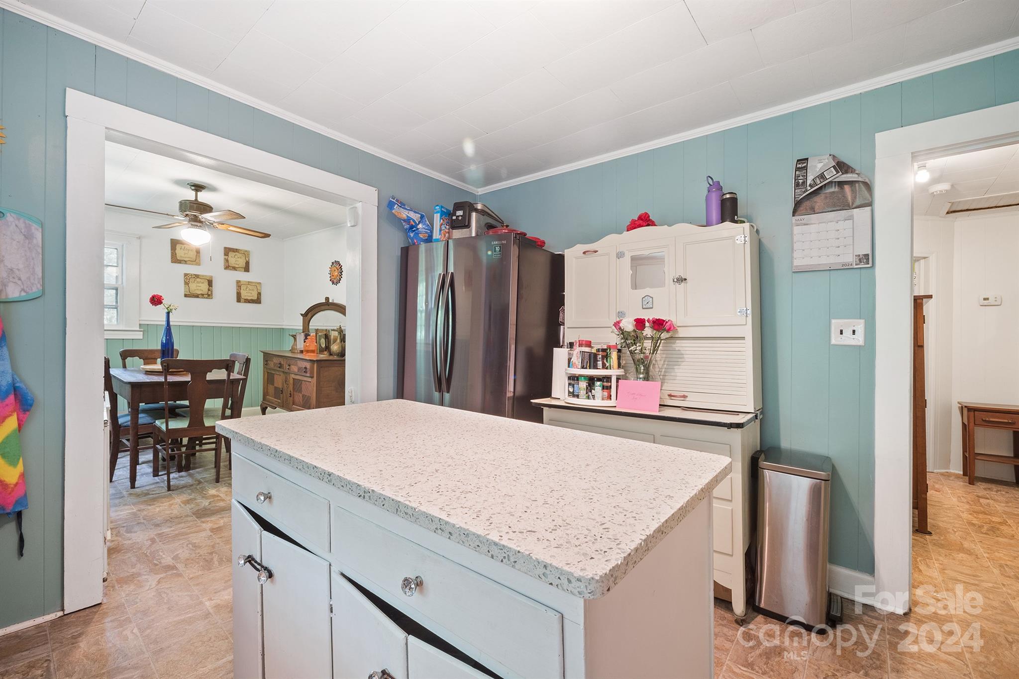 2711 Ellerwood Road Hudson, NC 28638 - Photo 9 of 19 a kitchen with a refrigerator and a table