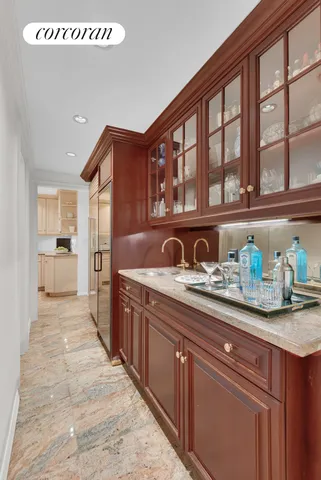 a kitchen with granite countertop a sink and cabinets