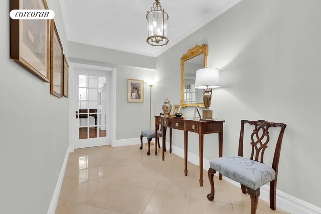 a view of a livingroom with furniture and chandelier