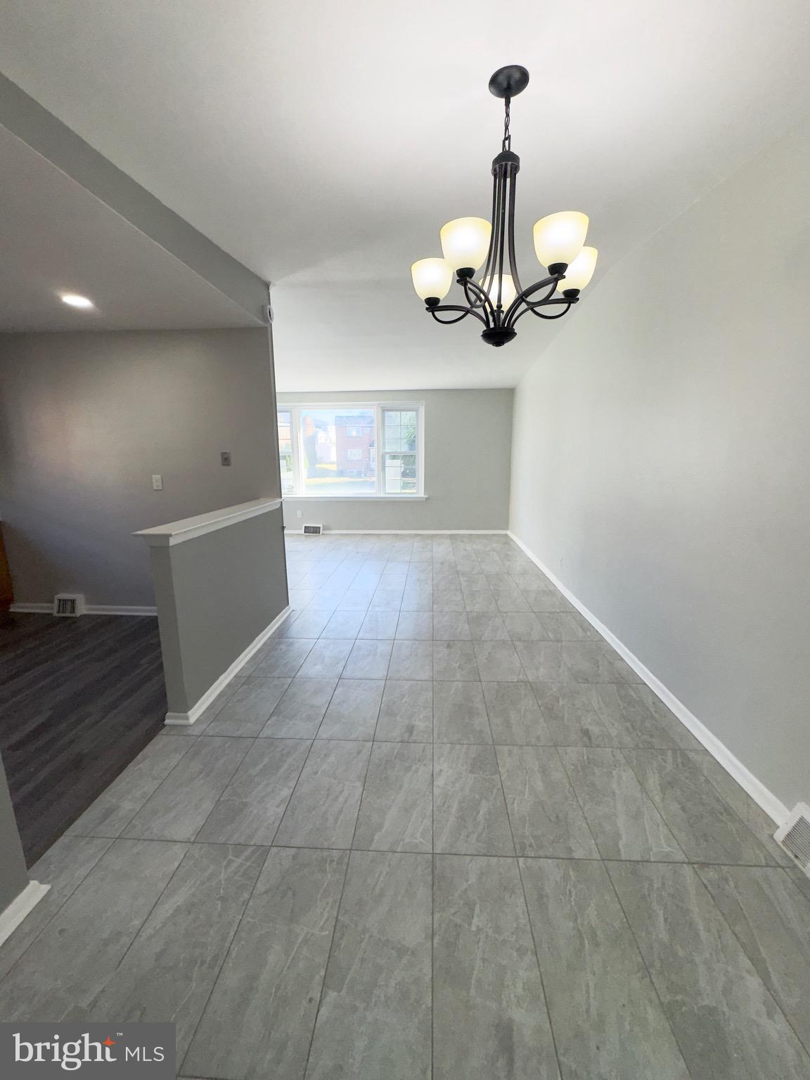 7806 Summerdale Avenue, Unit 1 Philadelphia, PA 19111 - Photo 4 of 9 a view of a livingroom with a chandelier