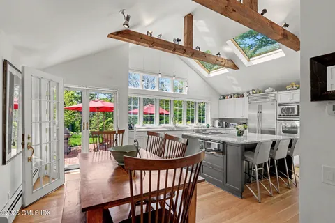 a view of a dining area with furniture window and wooden floor