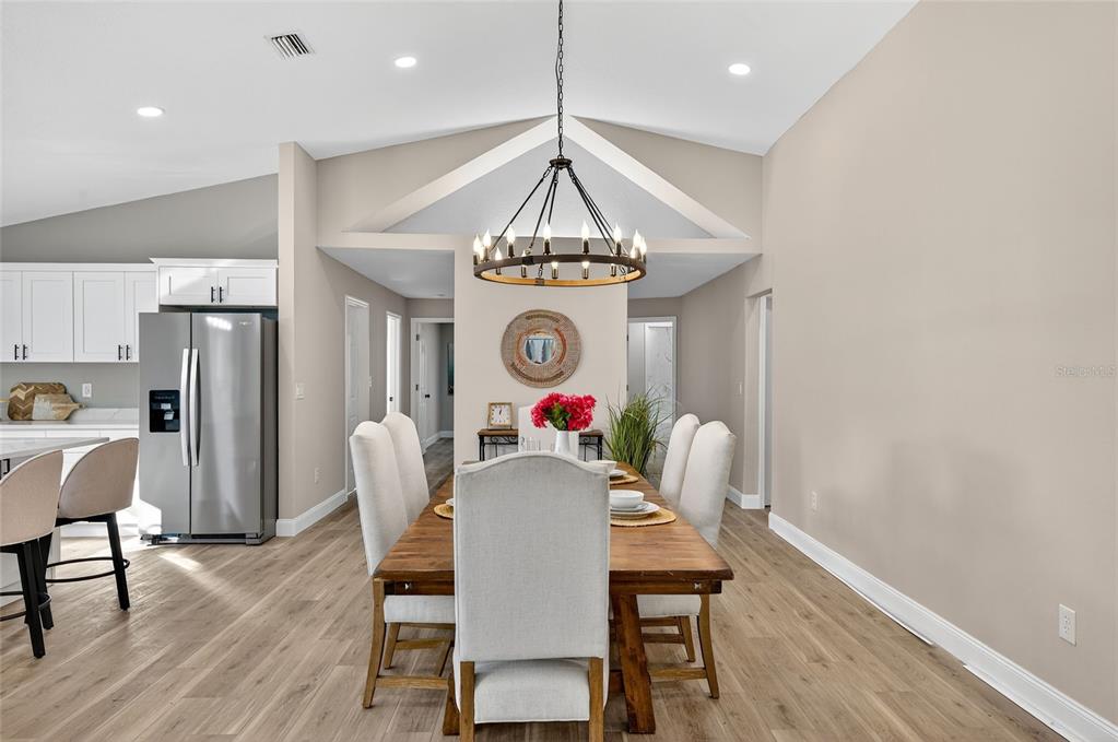 7078 South Threshold Point Homosassa, FL 34446 - Photo 14 of 75 a view of a dining room with furniture window and wooden floor