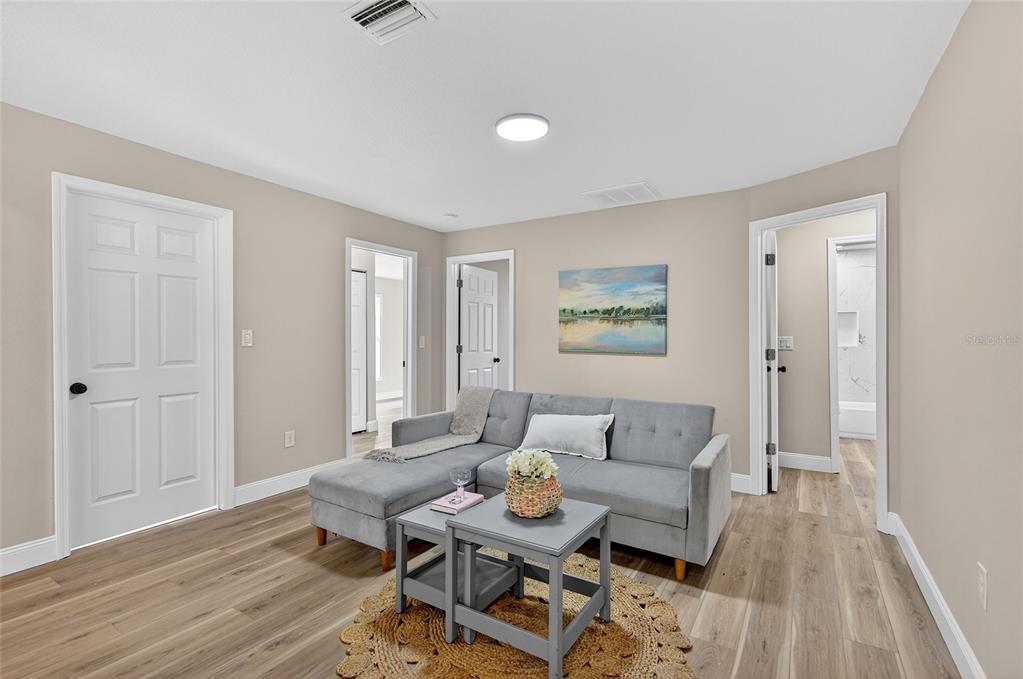 7078 South Threshold Point Homosassa, FL 34446 - Photo 17 of 75 a living room with furniture and wooden floor