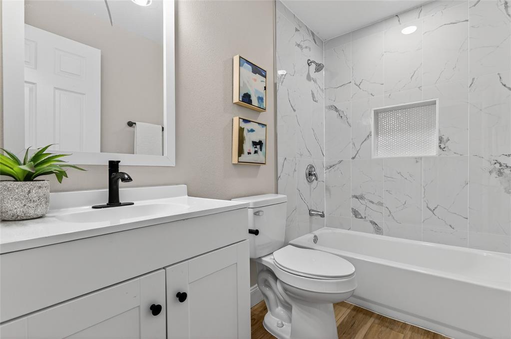 7078 South Threshold Point Homosassa, FL 34446 - Photo 21 of 75 a bathroom with a sink a toilet and a bathtub