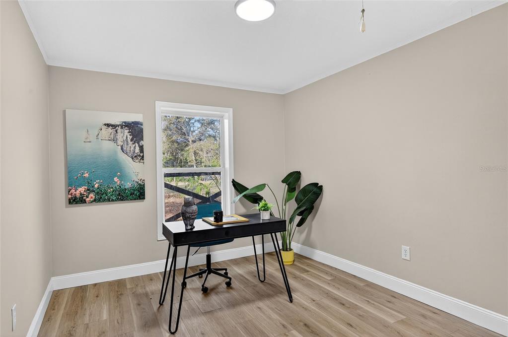 7078 South Threshold Point Homosassa, FL 34446 - Photo 22 of 75 a workspace room with furniture and wooden floor