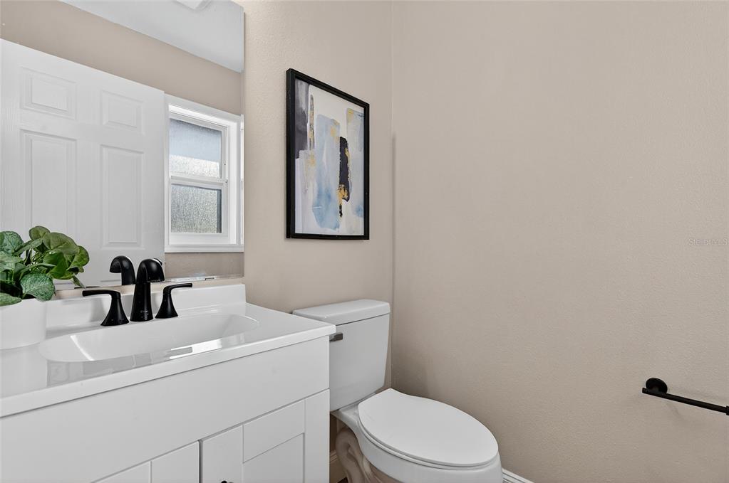 7078 South Threshold Point Homosassa, FL 34446 - Photo 26 of 75 a bathroom with a toilet sink and mirror