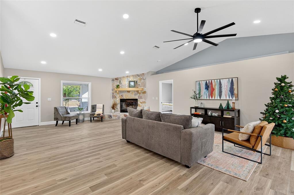 7078 South Threshold Point Homosassa, FL 34446 - Photo 31 of 75 a living room with furniture and a chandelier