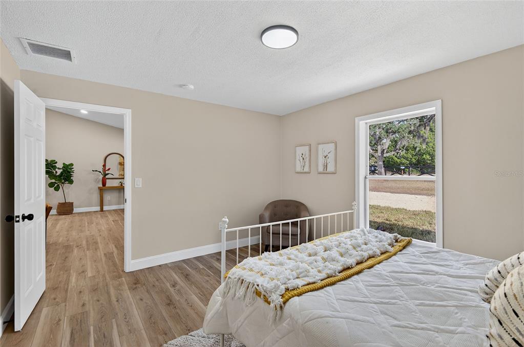 7078 South Threshold Point Homosassa, FL 34446 - Photo 39 of 75 a bedroom with a bed and a window