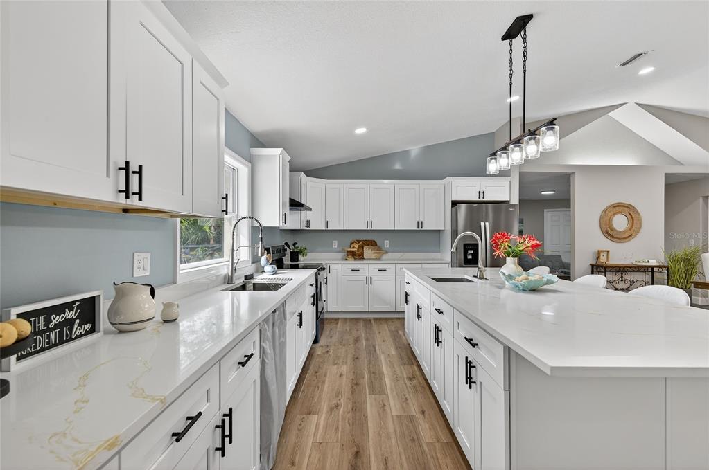 7078 South Threshold Point Homosassa, FL 34446 - Photo 40 of 75 a kitchen with a sink stove and cabinets