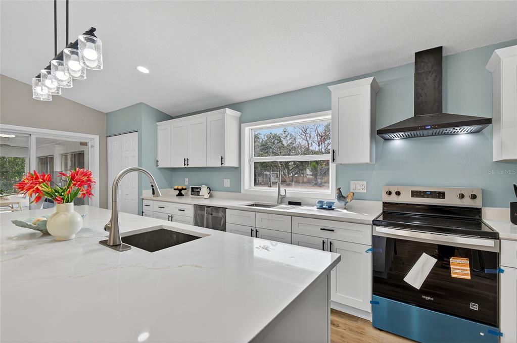 7078 South Threshold Point Homosassa, FL 34446 - Photo 43 of 75 a kitchen with a sink stove and cabinets