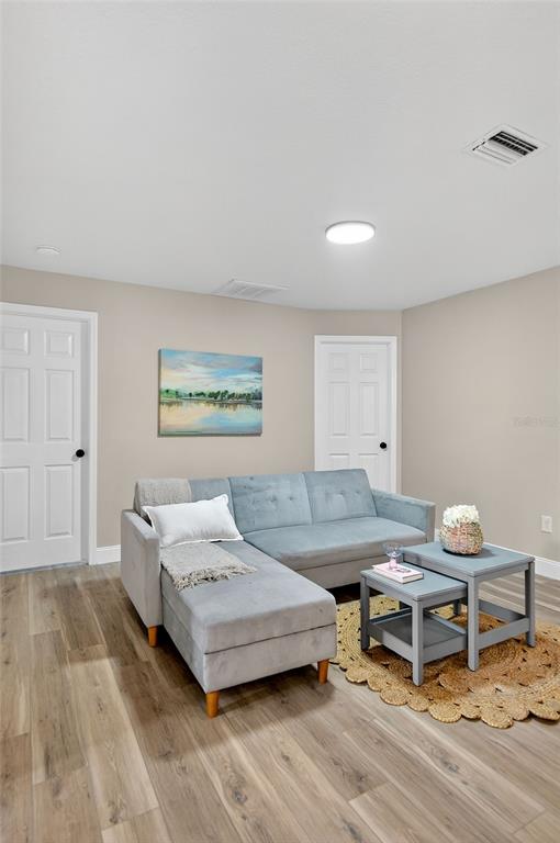 7078 South Threshold Point Homosassa, FL 34446 - Photo 44 of 75 a living room with a couch and a table