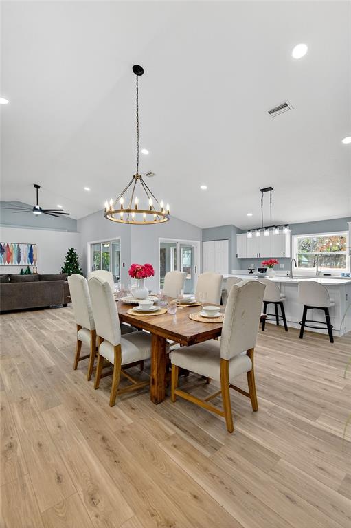 7078 South Threshold Point Homosassa, FL 34446 - Photo 45 of 75 a view of a dining room with furniture window and wooden floor