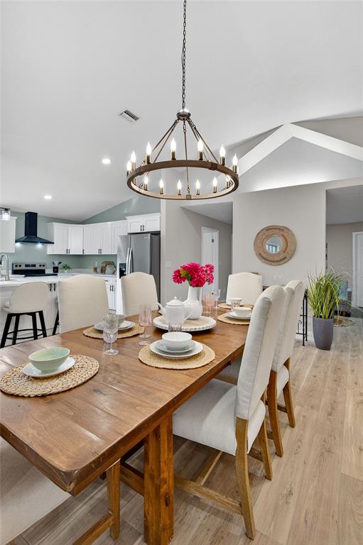 7078 South Threshold Point Homosassa, FL 34446 - Photo 46 of 75 a view of a dining room with furniture and wooden floor