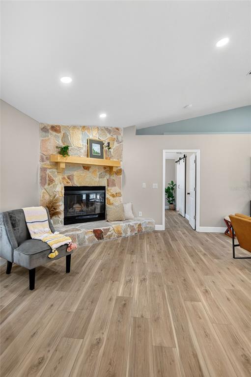 7078 South Threshold Point Homosassa, FL 34446 - Photo 50 of 75 a living room with furniture and a fireplace