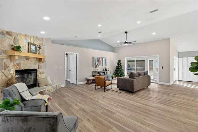a view of a dining room with furniture wooden floor and chandelier