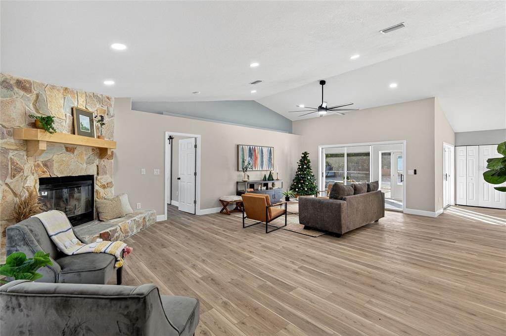 7078 South Threshold Point Homosassa, FL 34446 - Photo 6 of 75 a living room with furniture and a fireplace