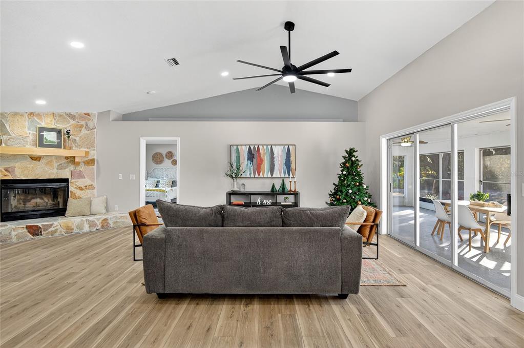 7078 South Threshold Point Homosassa, FL 34446 - Photo 7 of 75 a living room with furniture and a fireplace