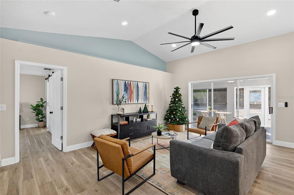 7078 South Threshold Point Homosassa, FL 34446 - Photo 9 of 75 a living room with furniture and a large window