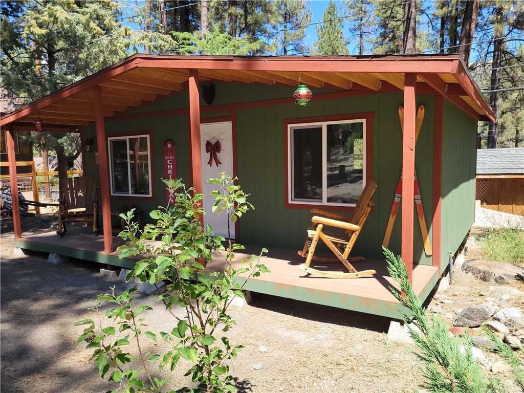 1116 Lark Road Wrightwood, CA 92397 - Photo 3 of 46 a front view of a house with a yard