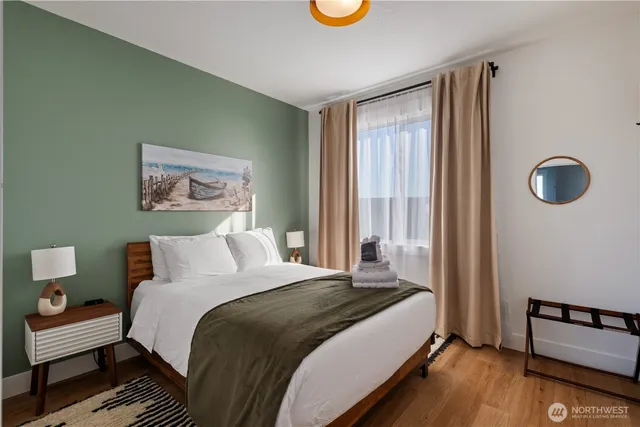 a spacious bedroom with a large bed and a window