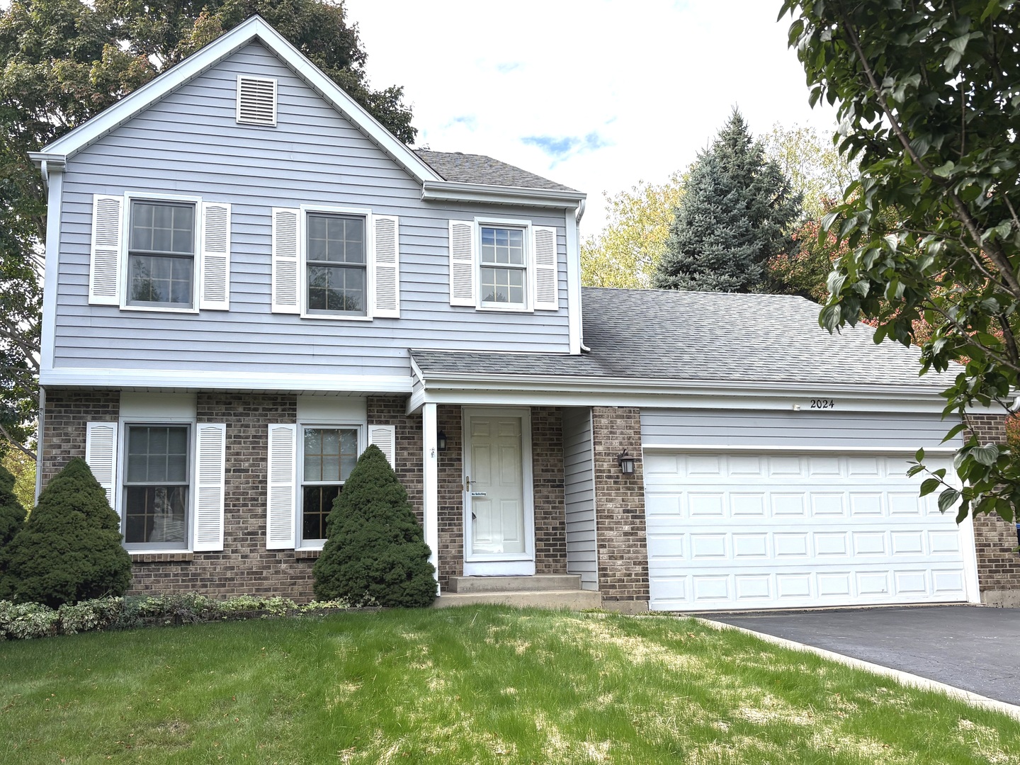 2024 Westfield Drive Gurnee, IL 60031 - Photo 1 of 9 a view of a house with a yard and plants