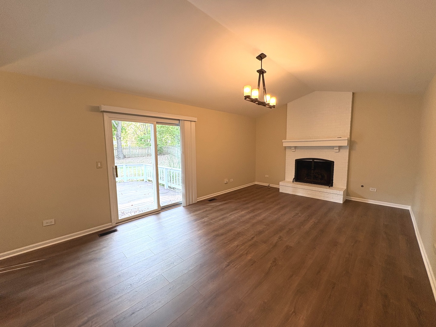 2024 Westfield Drive Gurnee, IL 60031 - Photo 5 of 9 a view of an empty room with wooden floor and a window