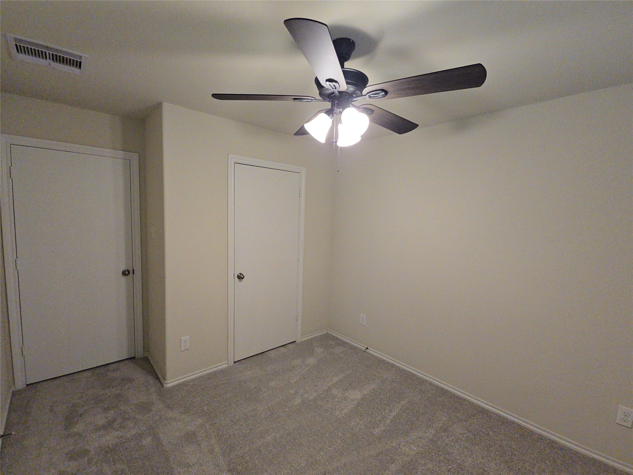 810 Lightningbug Lane Conroe, TX 77301 - Photo 12 of 27 a view of a chandelier fan in a room