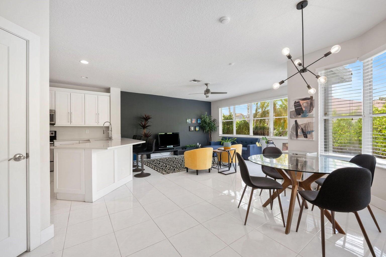 10982 Ravel Court Boca Raton, FL 33498 - Photo 8 of 43 a living room with furniture and a large window