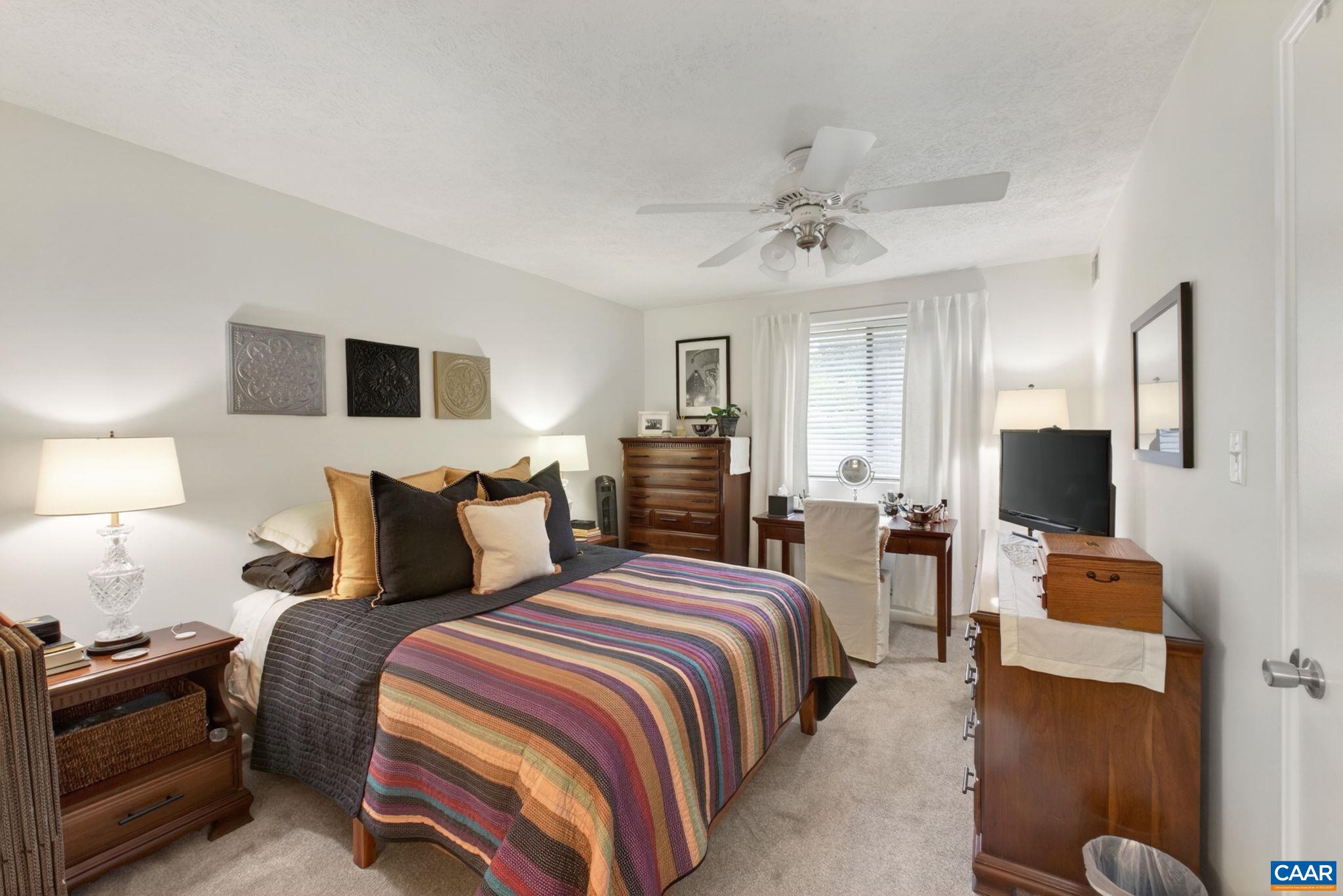 114 Turtle Creek Road, Unit 4 Charlottesville, VA 22901 - Photo 12 of 41 a bedroom with bed a flat tv screen and dresser