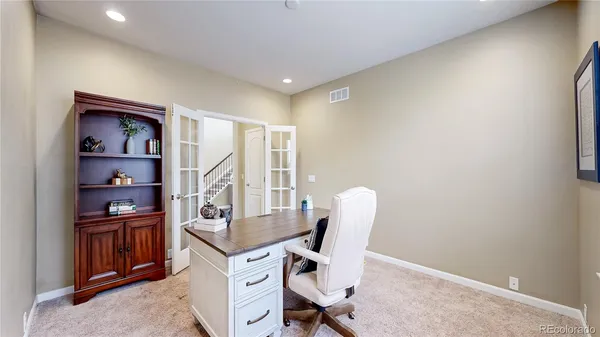 a view of a workspace with furniture