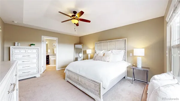 a bedroom with a bed and dresser