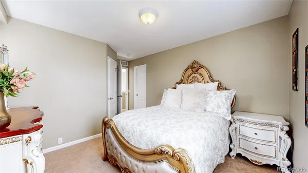 a bedroom with a bed and a dresser