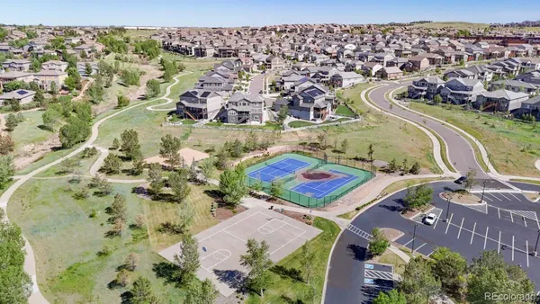 an aerial view of residential houses and outdoor space