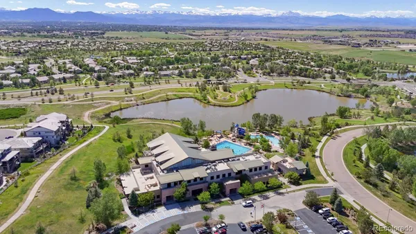 an aerial view of a houses with a lake view