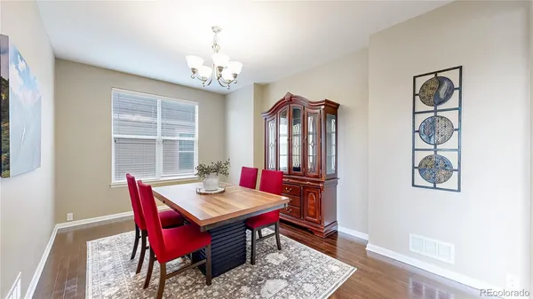 a view of a dining room with furniture window and wooden floor